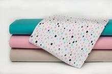 Tissu en ligne jersey de coton lycra brillant avec motifs de taches de couleurs. Online fabric cotton spandex glitter jersey knit with scratch.