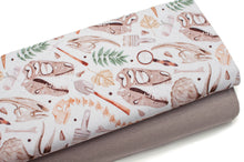 Tissus en ligne Québec jersey de coton lycra motif de fossile de dionsaure. Online fabric store cotton spandex jersey knit with fossil dino pattern.