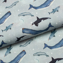 Tissu en ligne Québec jersey de coton lycra motif de baleines. Online fabric store cotton spandex jersey fabric from family frabics with whales.