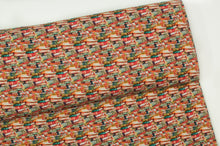 Tissu en ligne jersey de coton lycra motif de livres. Online fabric cotton spandex jersey knit with book.