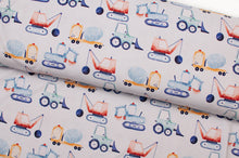 Tissu en ligne Québec jersey de coton lycra motif de camions de construction. Online fabric cotton spandex jersey knit with construction vehicle.