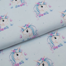 Tissu en ligne Québec jersey de coton lycra motif de licorne. Online fabric cotton spandex jersey knit with unicorn.