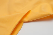 Tissu en ligne jersey de coton jaune. Online fabric yellow cotton jersey.