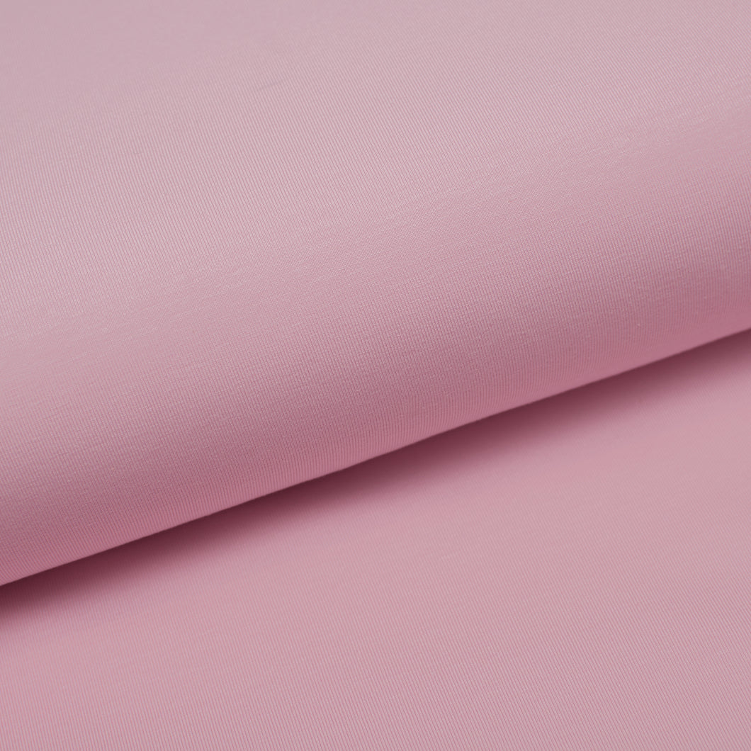Tissu en ligne french terry de coton lycra uni couleur rose pâle. Online fabric cotton spandex french terry solid color pale pink.