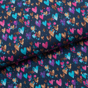 Tissu en ligne Québec jersey de coton lycra motif de coeur coloré. Online fabric cotton spandex jersey knit with colorful heart.