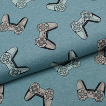 Tissu en ligne Québec jersey de coton lycra motif de manette de jeux vidéo. Online fabric cotton spandex knit with gaming controller print.