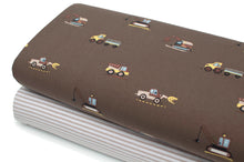 Tissu jersey coton spandex taupe imprimé engins de chantier.