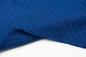 Tissu en ligne matelassé de coton couleur uni. Online fabric diamond quilted cotton solid color.