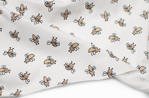 Tissu en ligne Québec jersey de coton lycra motif d'abeille avec brillant. Online fabric store cotton spandex jersey knit with glitter bee.