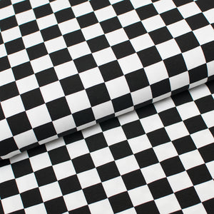 Tissu en ligne Québec jersey de coton lycra motif de carreaux. Online fabric cotton spandex jersey knit with black and white plaid.