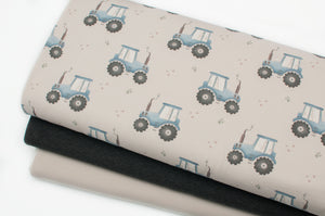 Tissu en ligne Québec jersey de coton lycra motif de tracteur. Online fabric cotton spandex jersey knit with tractor print.