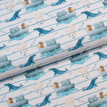 Tissu en ligne Québec jersey de coton lycra motif d'ourson capitaine de bateau et des baleines. Online Canadian fabric store cotton spandex jersey knit with a bear on a boat with whale.