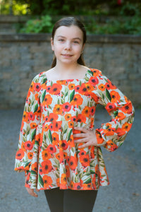 Tissu en ligne Québec jersey de coton lycra motif de fleurs. Online fabric cotton spandex jersey knit with orange flowers.