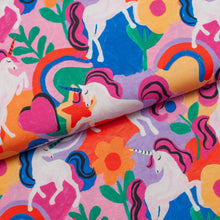 Tissu jersey de coton spandex multicolore imprimé licornes fleurs et arcs-en-ciel.