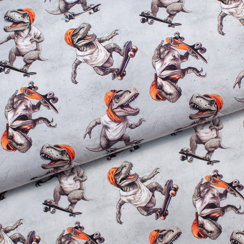 Tissu en ligne Québec jersey de coton lycra motif de dinosaure en skate. Online Canadian fabric store cotton spandex jersey knit with dinosaur doing skateboarding.