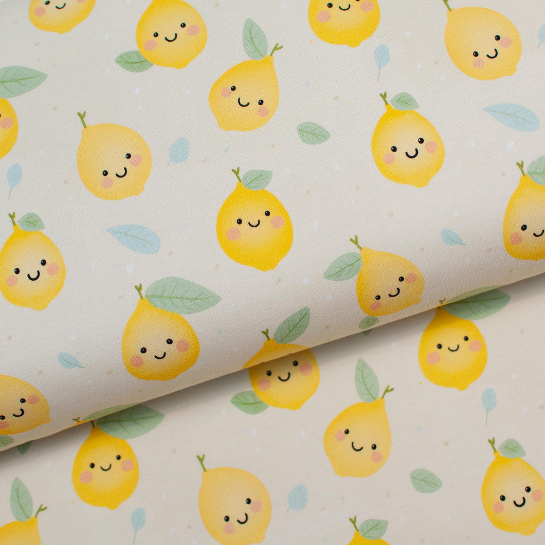 Tissu en ligne Québec jersey de coton lycra motif de citron kawaii. Online Canadian fabric store cotton spandex jersey knit with kawaii lemon.