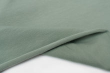 Tissu en ligne jersey de coton couleur uni vert. Online fabric cotton jersey solid green color.
