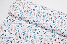 Tissu en ligne jersey de coton motif d'outils. Online fabric cotton jersey knit with tools.