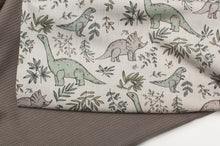 Tissu en ligne jersey de coton lycra motif de dinosaure. Online fabric cotton jersey knit with dinosaur.