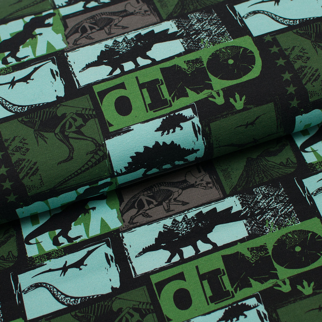 Tissu en ligne french terry brossé de coton lycra motif de dinosaure. Online fabric cotton brushed french terry knit with dinosaur.
