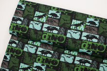 Tissu en ligne french terry brossé de coton lycra motif de dinosaure. Online fabric cotton brushed french terry knit with dinosaur.