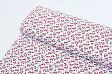 Tissu jersey de coton motif de cerise. Cherry cotton jersey fabric.
