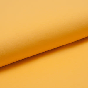 Tissu en ligne jersey de coton jaune. Online fabric yellow cotton jersey.