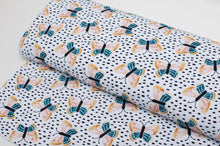 French terry cotton line fabric with butterfly pattern. Online fabric cotton french terry butterfly design.