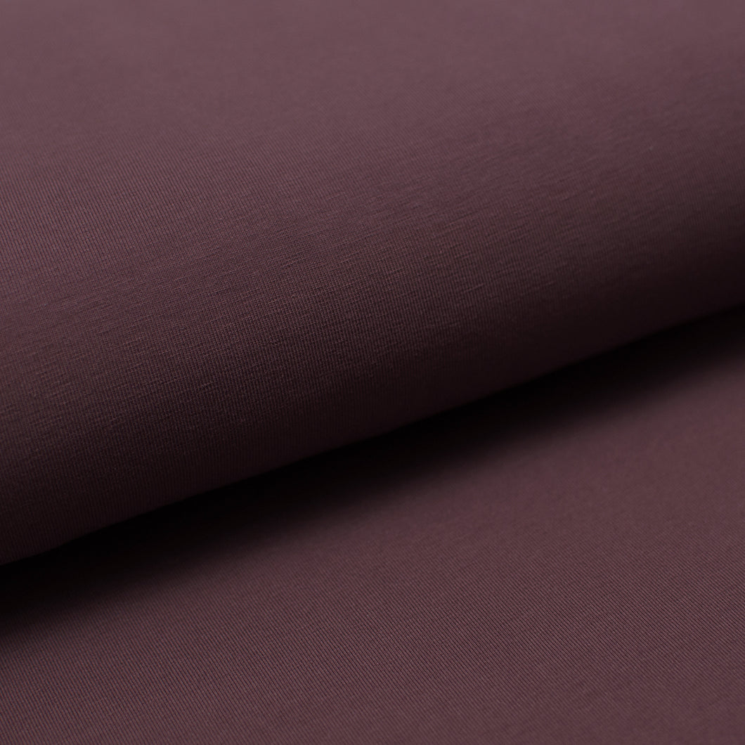 Tissu en ligne french terry de coton couleur mauve prune. Online fabric cotton french terry solid color.